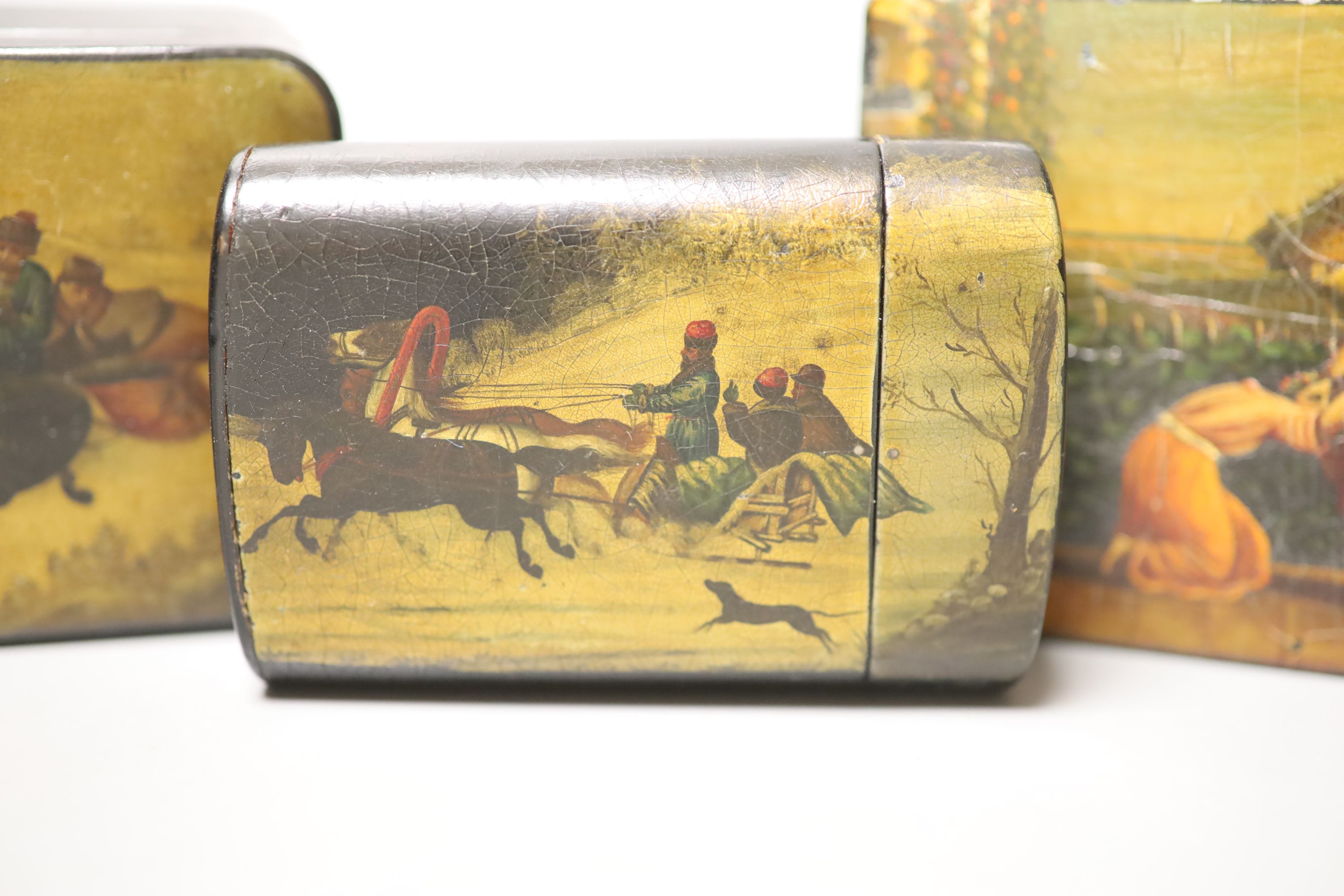 Two Russian papier mache boxes painted with troika and two related items, largest 17 x 5cm